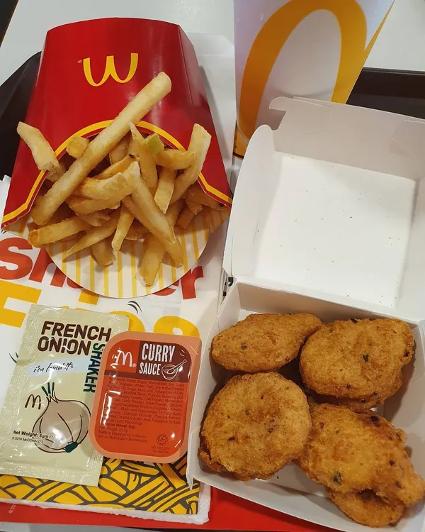 Spicy McNuggets (6 pcs) and French onion shaker fries ($7.10)!