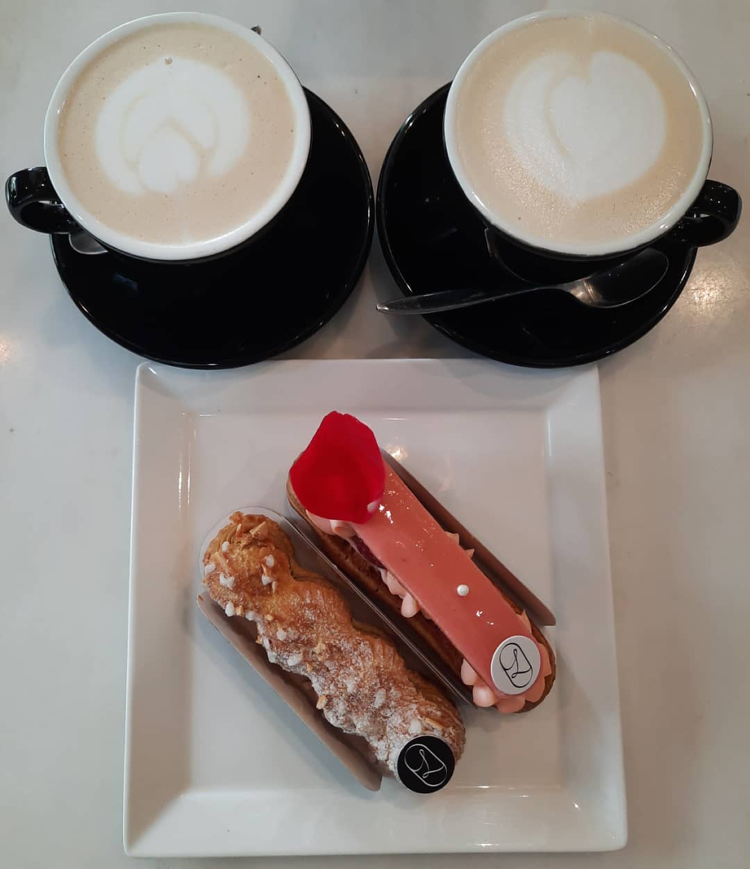 High tea time — two lattes + two eclairs (Burpple Beyond: $14)!