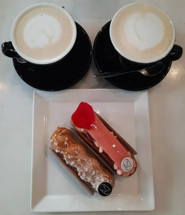High tea time — two lattes + two eclairs (Burpple Beyond: $14)!