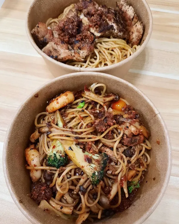 Mala shrimp spaghetti + Chicken chop laksa spaghetti ($7.50 + $8.50)!