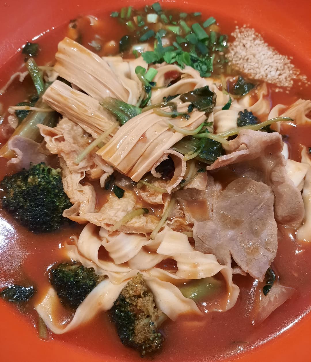 Tomato soup malatang — wide noodles + pork + broccoli ($14)!