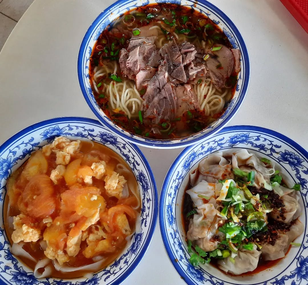 Beef ramen + tomato egg shaved noodles + spicy dumplings ($17.50)!