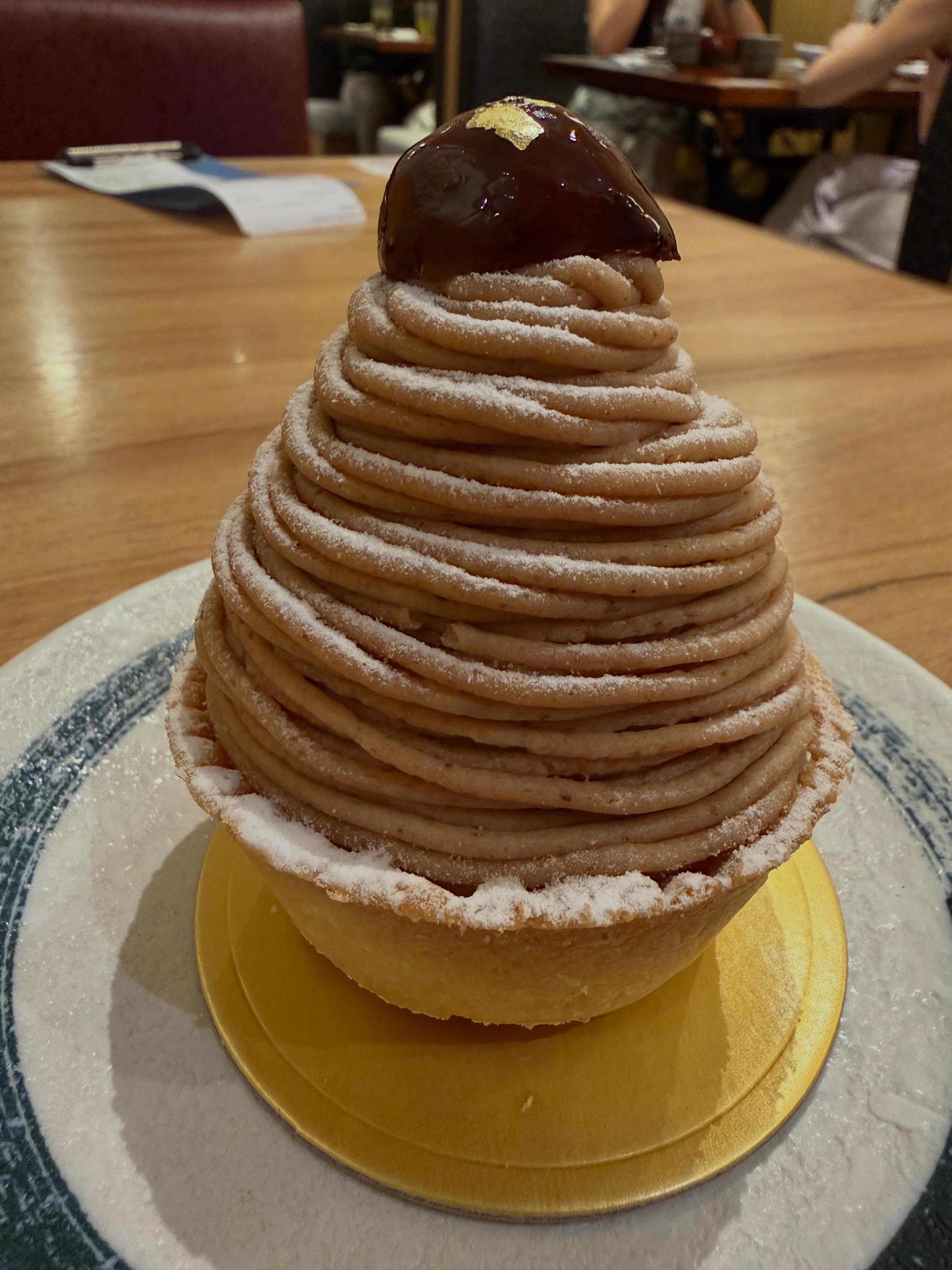 Tampopo's Mont Blanc, a tower of piped chestnut cream dusted with icing sugar and topped with a glazed chestnut