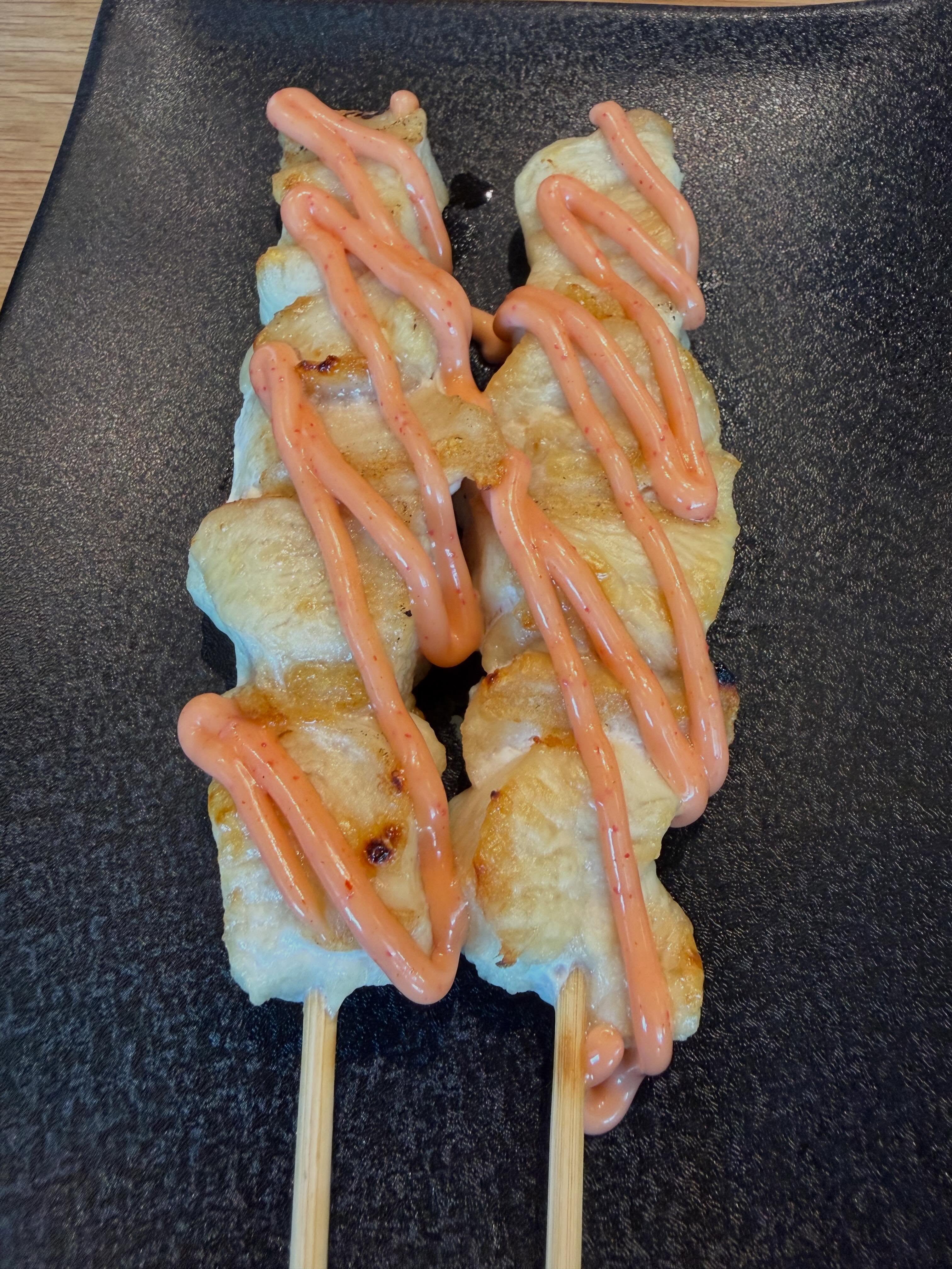 Chicken Breast with Mentaiko Sauce, drizzled with pink sauce at Torikizoku